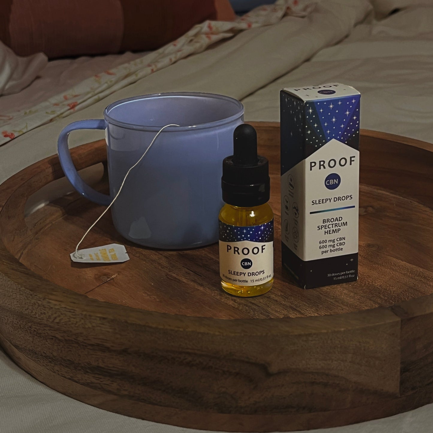 Proof Remedy CBN Sleepy Drops bottle and packaging with a mug of tea, promoting restful sleep with hemp CBD and CBN.